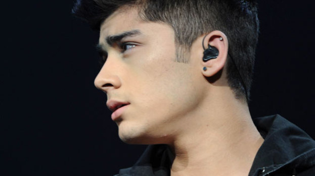 The boy is back in town: Zayn makes a flying visit back to the UK
