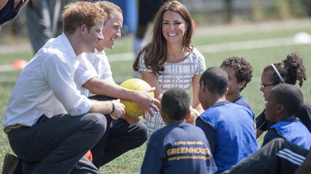 Good sports: Duchess Catherine with her husband Prince William and his brother Prince Harry