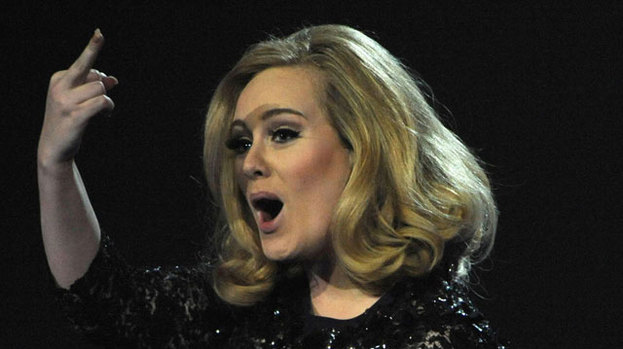 Fingering, the culprit: Adele gestures after being asked to leave the stage during her acceptance speech