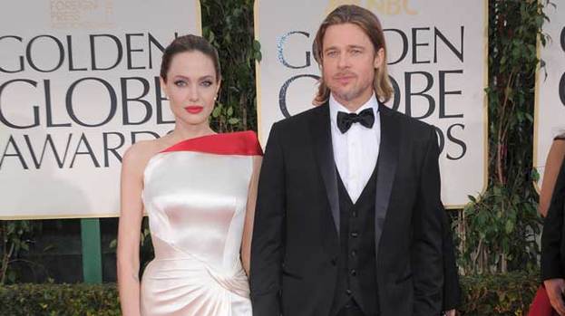 Top advice: Angelina (pictured with partner Brad Pitt) has reportedly been giving Johnny Depp relationship advice