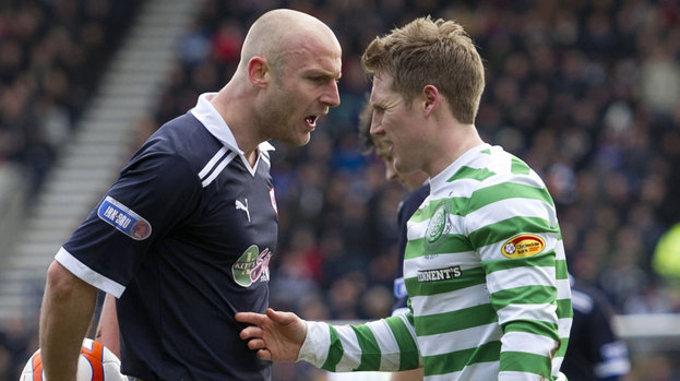 Raith Rovers' Simon Mensing (left) has words with Kris Commons after conceding a penalty.