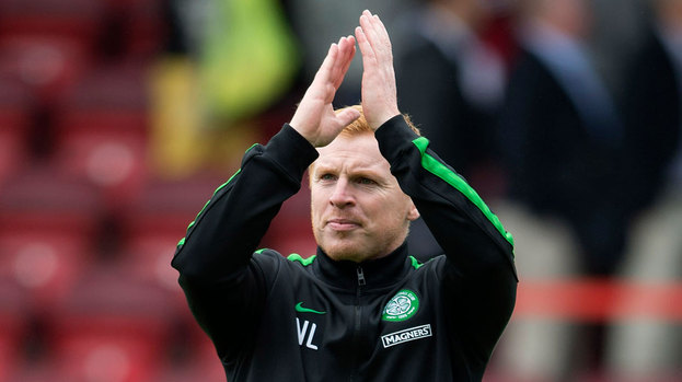 Celtic manager Neil Lennon applauds the traveling support at full time