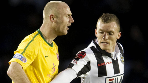 Hamilton's Simon Mensing and David Barron clash.